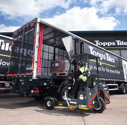 Loading a Topps Tiles lorry with a pallet