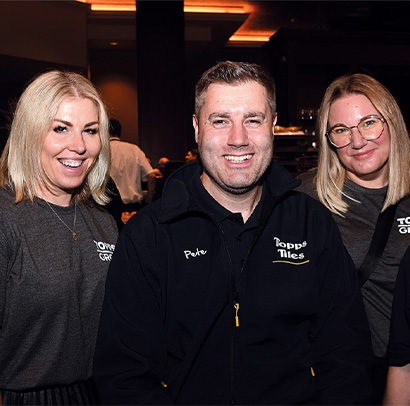 Group of colleagues smiling at event